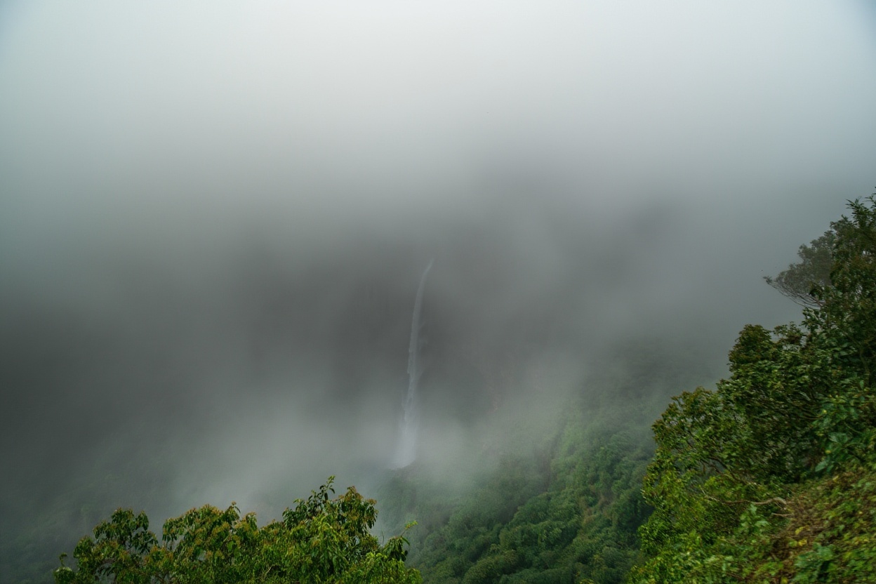 Salalah during the Khareef — the Indian Ocean monsoon turns the Dhofar hills green for three months