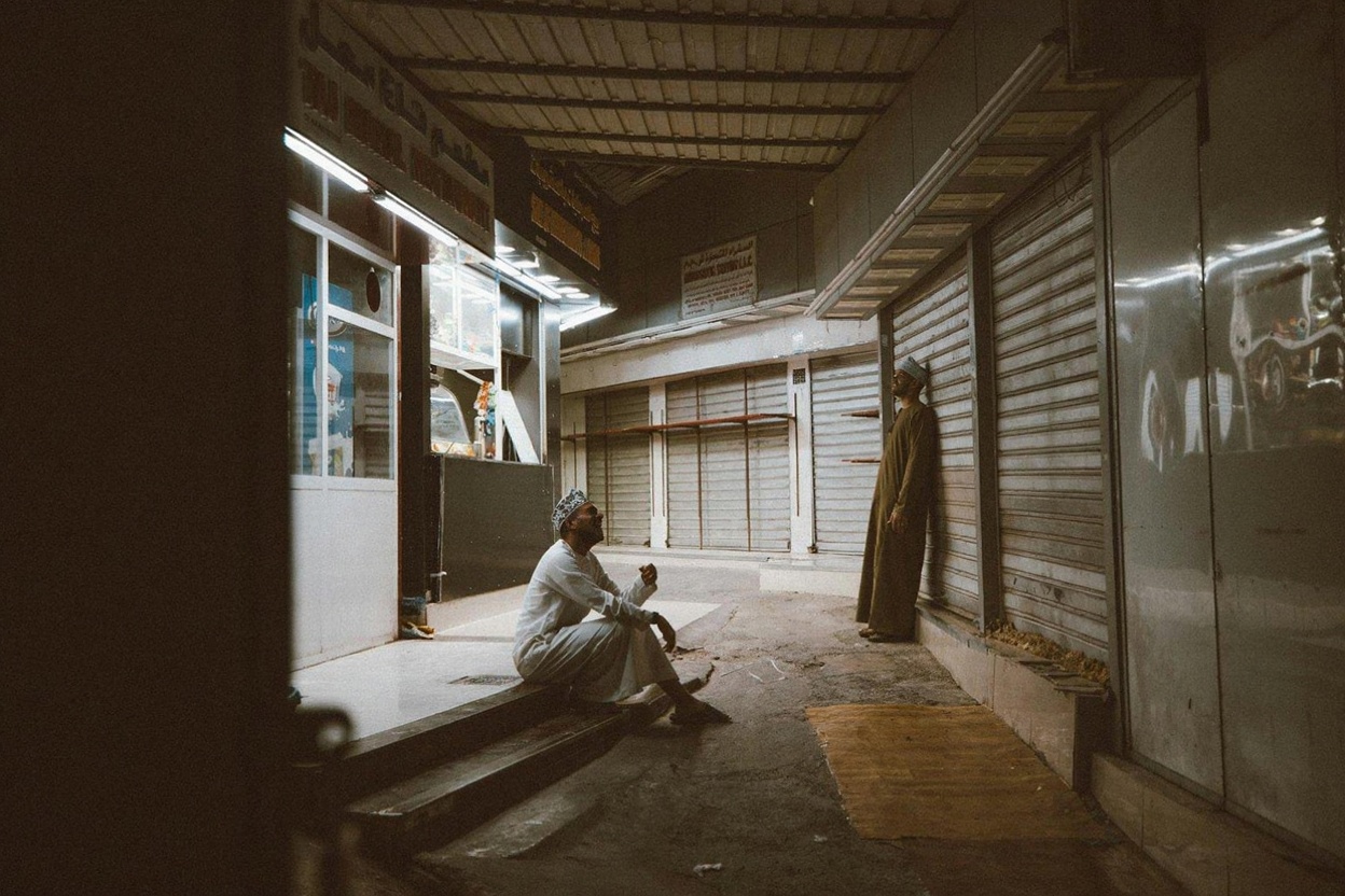 Muttrah Souq interior — frankincense smoke, silver stalls, and the low hum of negotiation in several languages